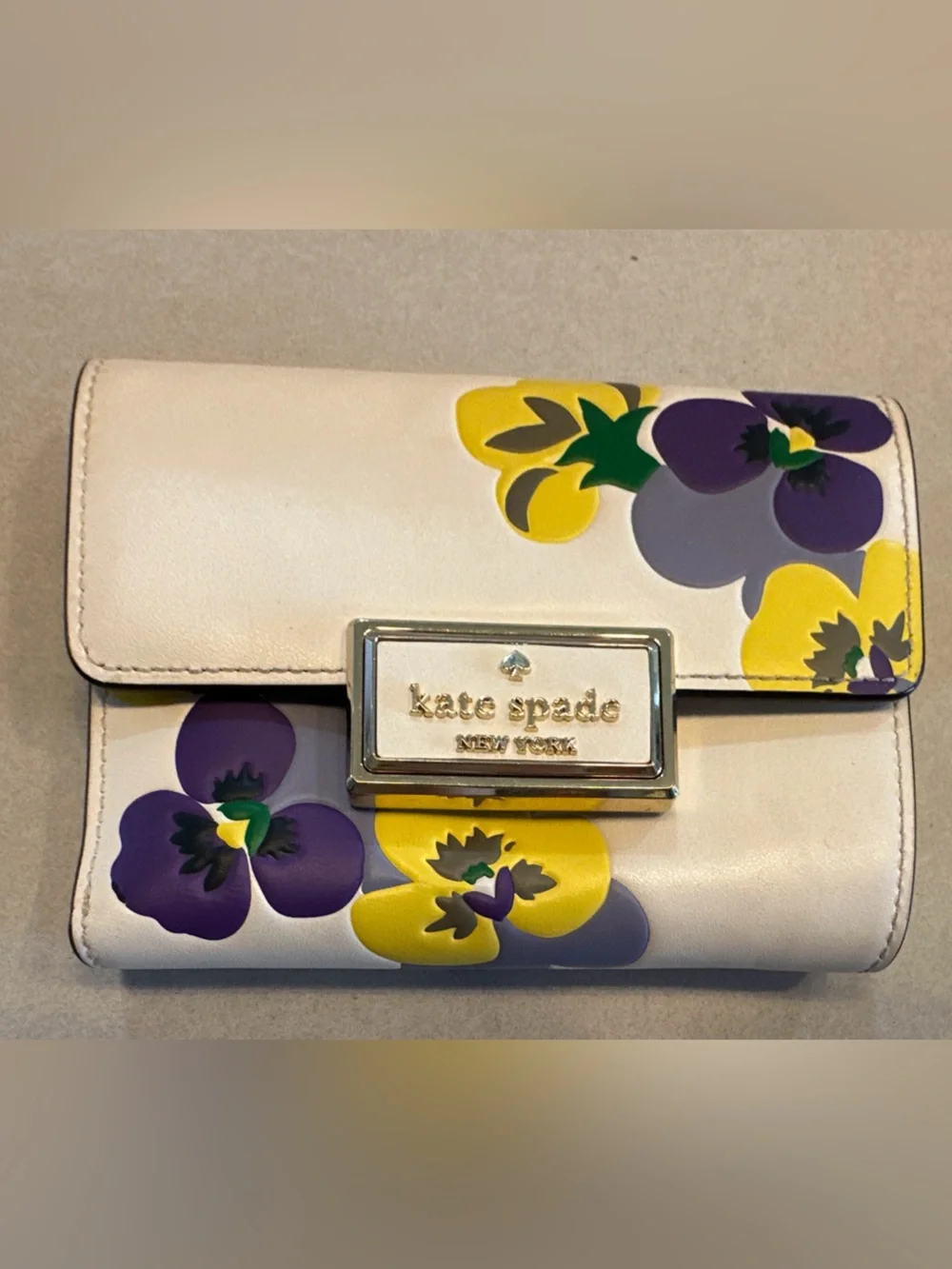 Kate Spade New York Reegan Pansy cream wallet with purple and yellow floral